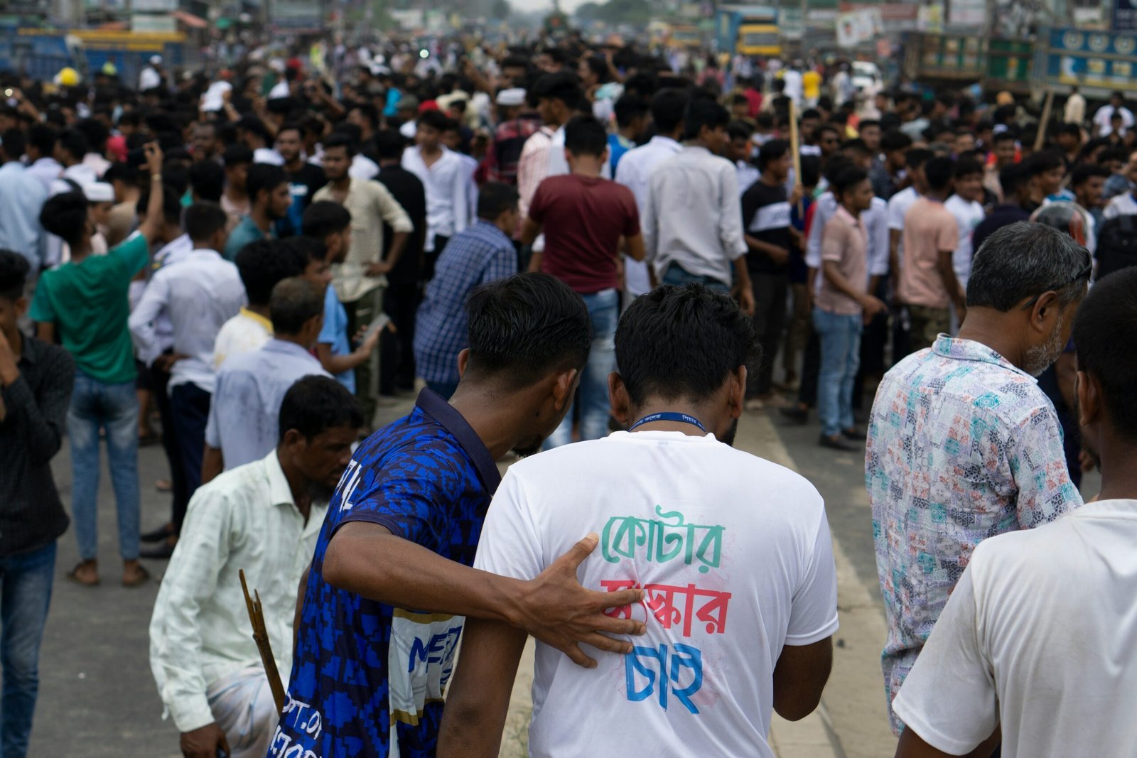 A large group of people walking down a street